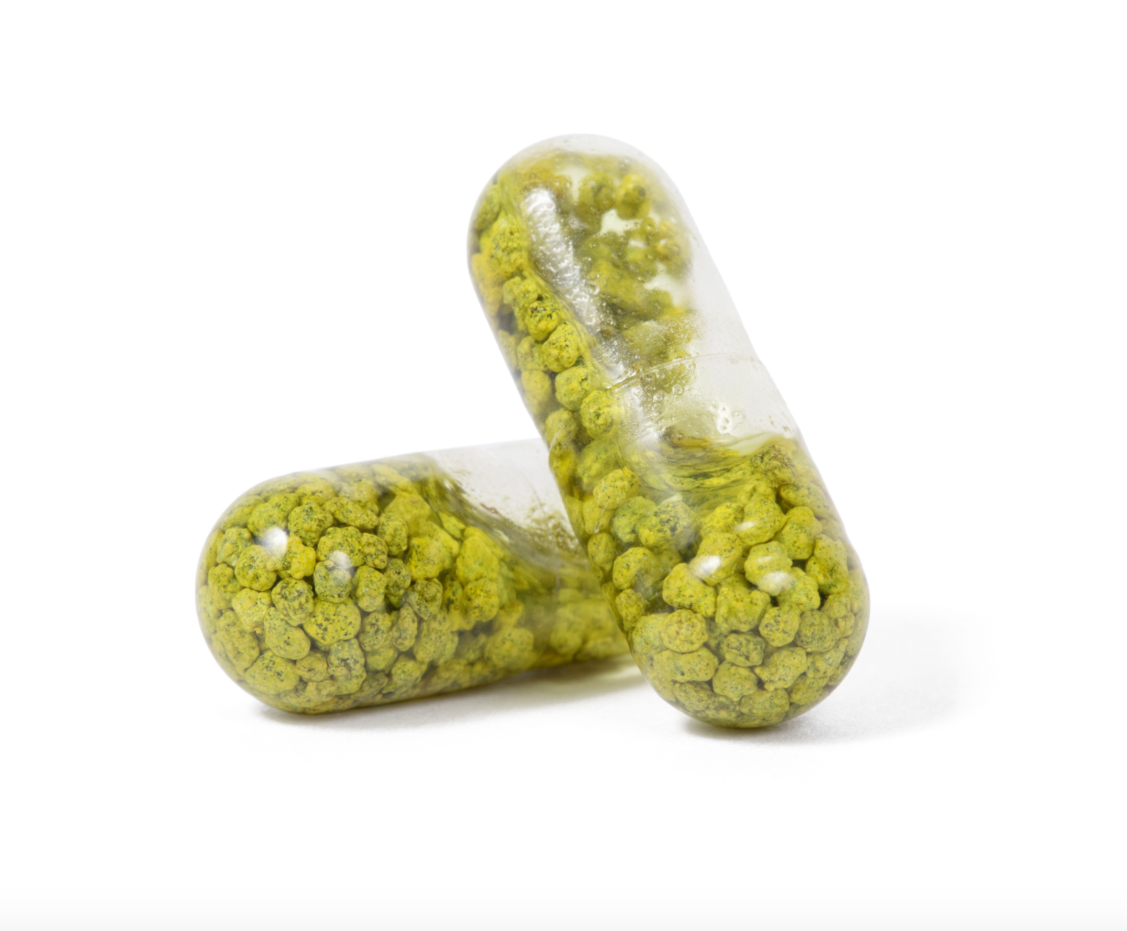 Two capsules of Elixinol Life's Liver Love Supplements stacked on top of each other